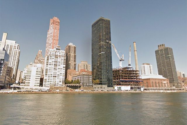 One East River Place is the skyscraper with the dark windows